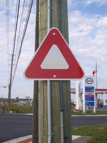 [Upside-down yield sign]