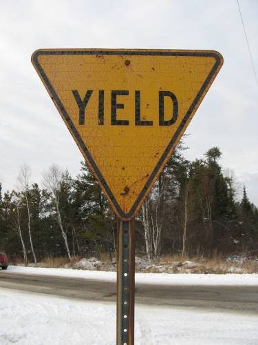 [Yellow yield sign]